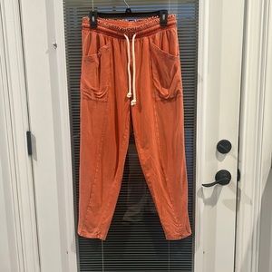 Women’s orange flowy pants.